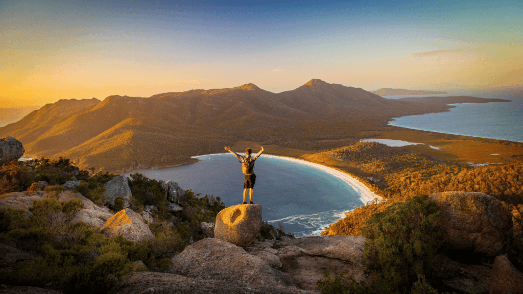 A man standing above a lake in Tasmania.
