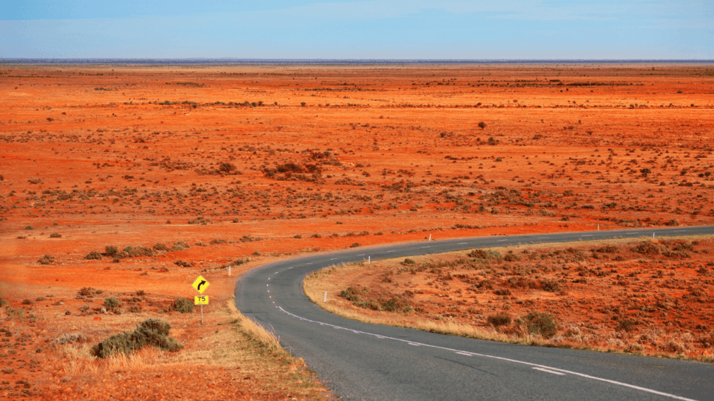 A sealed road in the Australian Outback.