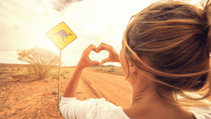 A woman making a heart sign with hear hands in the Australian Outback